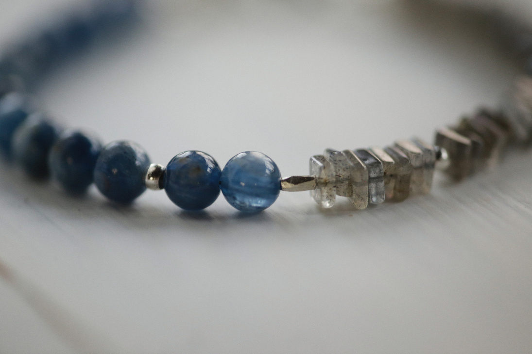Blue Beaded Bracelet on White Surface